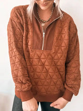 Geometric quilted half zip rust colored sweatshirt with diamond pattern and ribbed cuffs machine wash care instructions