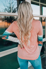 Women’s geometric round neck long sleeve coral T-shirt with patterned sleeves