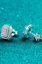 Geometric sterling silver stud earrings with pink cubic zirconia halo
