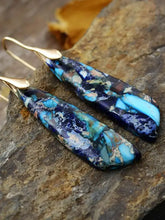 Geometrical shape dangle earrings with blue turquoise jasper pendants