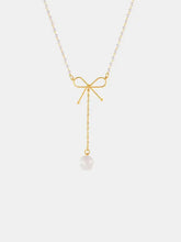 Gold bow pendant necklace with pearl drop on stainless steel chain
