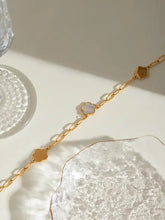 Gold chain necklace with white mother-of-pearl inlay, cloud and flower charms