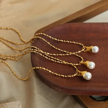 Elegant titanium steel pearl pendant necklace with gold chain and pearl tassels