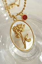 Gold copper necklace with flower shell pendant and turquoise charm