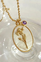 Gold copper necklace with flower shell pendant and turquoise charm