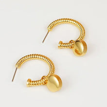 Gold hoop earrings with cat’s eye stone charms