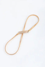 Gold iron skinny belt with metallic clasp on elastic lanyard