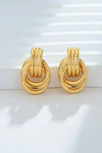 Gold-plated knotted stud earrings with oval hoop design