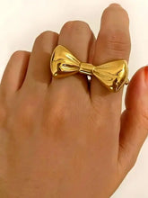 Elegant 18K gold-plated stainless steel bow ring on finger