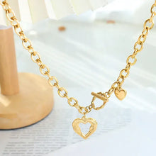 Gold-plated titanium steel heart pendant necklace with ornate open heart charm