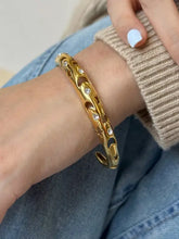 Armband aus Edelstahl mit eingelegten Strasssteinen und Ausschnitten