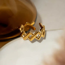 Gold stainless steel cutout open ring hoop earrings with X pattern