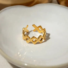 Gold stainless steel cutout open ring with wavy X pattern