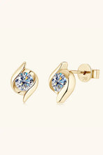 Gold stud earrings with brilliant round-cut diamonds in swirling bypass setting
