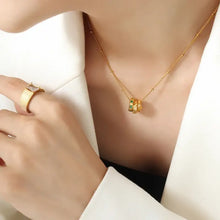 Gold titanium steel inlaid zircon pendant necklace with green gemstones