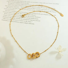 Gold titanium steel inlaid zircon pendant necklace with interlocking circles