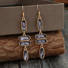 Gold-toned alloy colourful stone earrings with grey faceted gemstones
