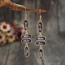 Gold-toned alloy colourful stone earrings with grey faceted gemstones