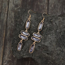 Gold-toned alloy colourful stone earrings with grey faceted gems