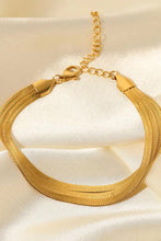 Gold triple-layered snake chain bracelet with adjustable clasp