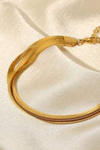 Gold triple-layered snake chain bracelet with adjustable clasp