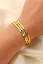 Gold triple-layered snake chain bracelet with adjustable clasp