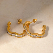 Pair of wavy gold stainless steel inlaid zircon hoop earrings with square-cut gems