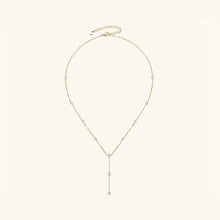 Gold-tone Y-shaped lariat necklace with bezel-set cubic zirconia stations