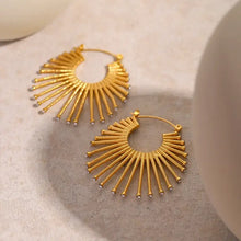 Golden sunburst fan hoop earrings with clear gemstone accents