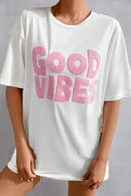 White oversized Good Vibes round neck half sleeve T-shirt with pink graphic