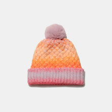 Gradient knit hat with pink pom-pom and ombre pattern