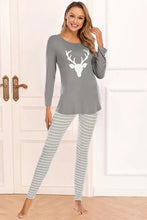 Gray long-sleeved pajama top with white deer graphic and matching striped leggings set for comfortable loungewear