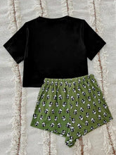 Black velvet graphic tee with short sleeve length paired with olive green panda print shorts lounge set