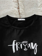 Black satin graphic tee with white cursive friday text featuring a wine glass i and short sleeve length in lounge set