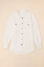White button-up shirt with black buttons, pockets, and sleeve length options