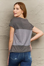 Gray and white striped V-neck top with regular sleeve length