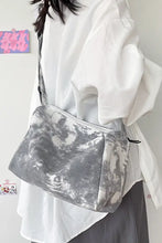 Silver and gray marble canvas crossbody bag with black accents