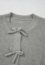 Gray lace-up cardigan sweater with bow neckline and ribbed cuffs