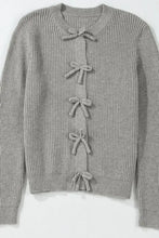 Gray lace-up cardigan sweater with bow detail and ribbed texture