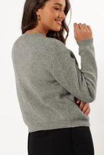 Gray ribbed knit sweater with lace-up details and cuffs
