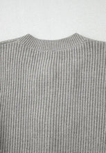 Gray ribbed crew neck sweater with lace-up cardigan details
