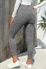 Gray ribbed knit jogger pants with high waist, hip-hugging fit, full length, white top, sneakers