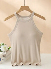Beige grecian neck tank with chest pads featuring a sleeveless design scalloped hem and ribbed trim