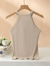 Beige ribbed knit grecian neck tank with chest pads featuring scalloped hem and thin shoulder straps