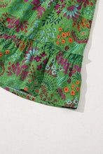 Green floral tiered dress with ruffled sleeves and skirt