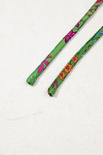 Green floral headband with pink yellow flowers, elastic band