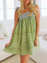 Green floral summer dress with striped straps, smocked waist, and ruffles