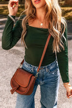 Olive green long sleeve bodysuit with square neckline and shoulder tassels