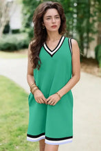 Green sleeveless jersey dress with black and white trim, machine wash cold