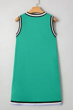 Green sleeveless jersey dress with black and white trim, machine wash cold